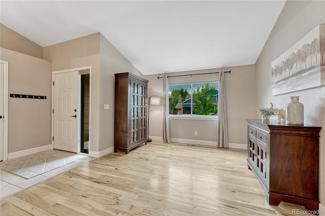 5402 S Queen Way, Littleton, CO 80127 - foyer with vaulted ceiling and light wood-style flooring