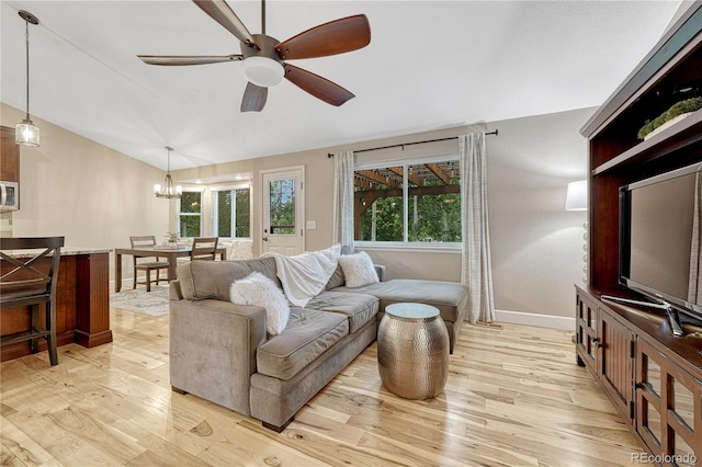5402 S Queen Way, Littleton, CO 80127 - living room with light wood-type flooring, a ceiling fan, vaulted ceiling, and a chandelier