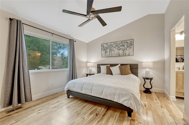 5402 S Queen Way, Littleton, CO 80127 - bedroom featuring lofted ceiling, wood finished floors, and a ceiling fan