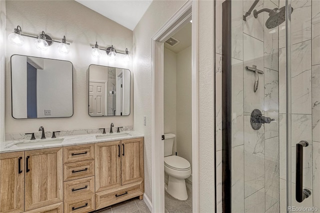 5402 S Queen Way, Littleton, CO 80127 - bathroom featuring a stall shower, double vanity, vaulted ceiling, and tile patterned floors