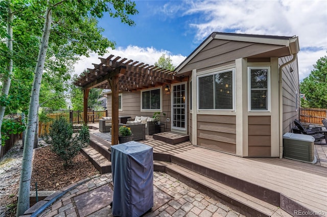 5402 S Queen Way, Littleton, CO 80127 - fenced backyard with outdoor lounge area, a pergola, and a deck