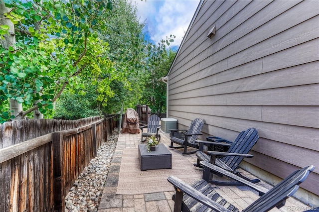 5402 S Queen Way, Littleton, CO 80127 - fenced backyard featuring a patio area