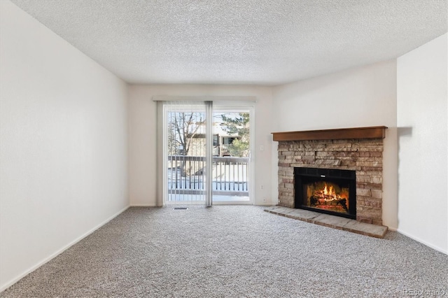 unfurnished living room with carpet and a textured ceiling