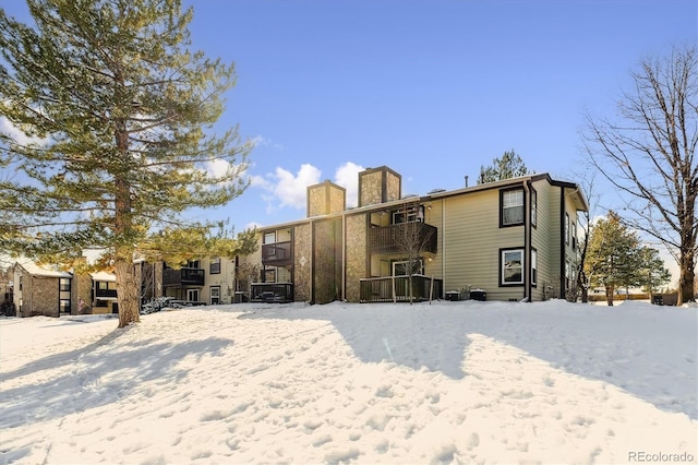 view of snow covered house