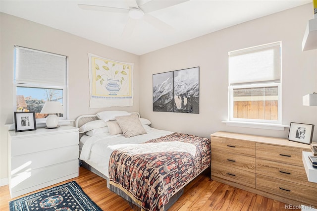 bedroom featuring light hardwood / wood-style flooring and ceiling fan