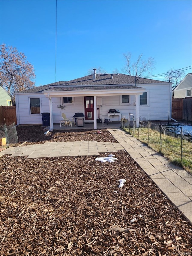 rear view of house with a patio