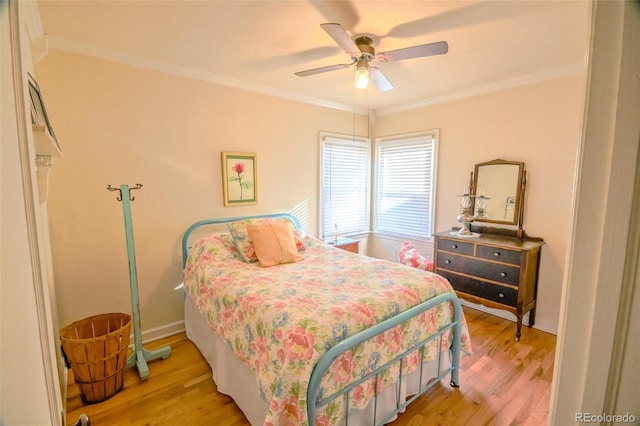 bedroom featuring ceiling fan, ornamental molding, and light wood-type flooring