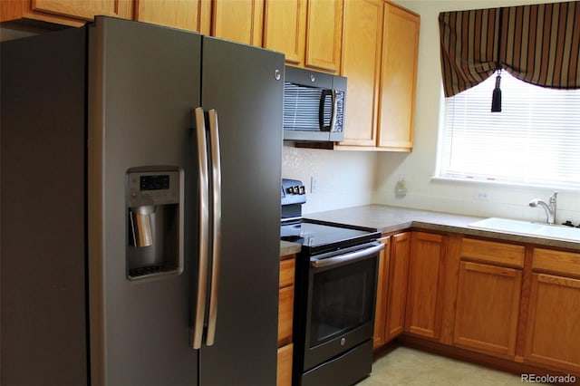 kitchen featuring sink and appliances with stainless steel finishes