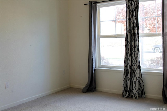 empty room with light colored carpet