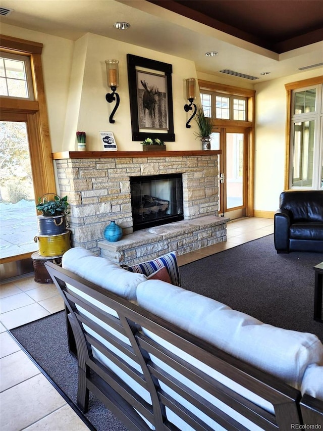 3220 Boulder Cir Unit 103, Broomfield, CO 80023 - tiled living area featuring a stone fireplace and recessed lighting