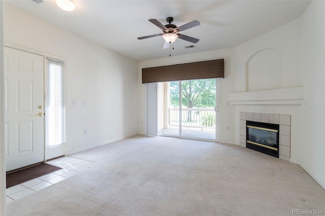 3220 Boulder Cir Unit 103, Broomfield, CO 80023 - unfurnished living room featuring a tile fireplace, carpet flooring, and a ceiling fan
