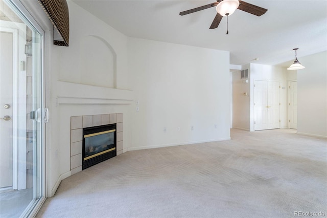 3220 Boulder Cir Unit 103, Broomfield, CO 80023 - unfurnished living room with carpet floors, ceiling fan, and a tiled fireplace