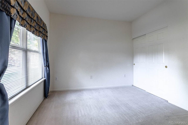 3220 Boulder Cir Unit 103, Broomfield, CO 80023 - unfurnished bedroom with light colored carpet and a closet