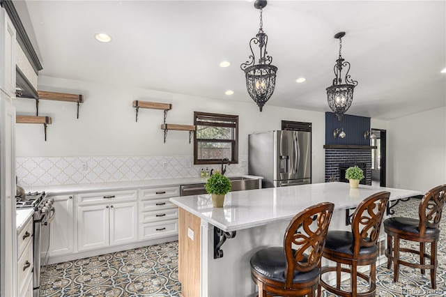 19 Rock Ln, Castle Rock, CO 80104 - kitchen with appliances with stainless steel finishes, open shelves, a fireplace, recessed lighting, and white cabinets