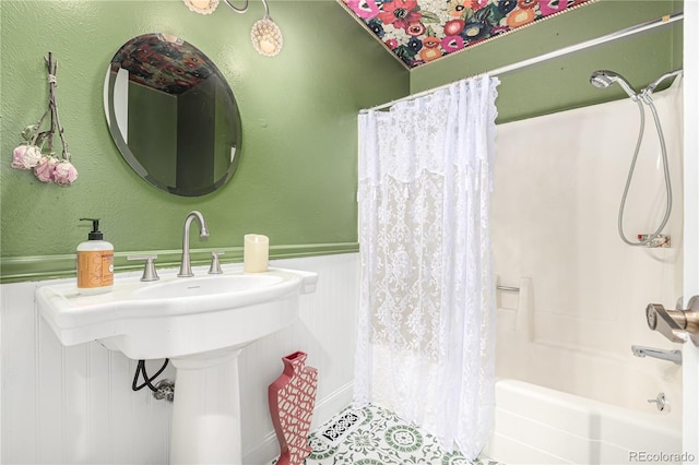 19 Rock Ln, Castle Rock, CO 80104 - full bathroom with shower / bath combination with curtain, wainscoting, and tile patterned floors