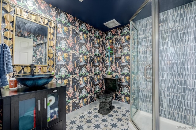 19 Rock Ln, Castle Rock, CO 80104 - full bathroom featuring wallpapered walls, vanity, tile patterned floors, and a shower stall