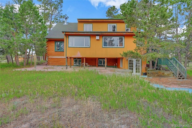 12524 Hilltop Pl, Kiowa, CO 80117 - rear view of property with log exterior, a patio, stairs, and french doors