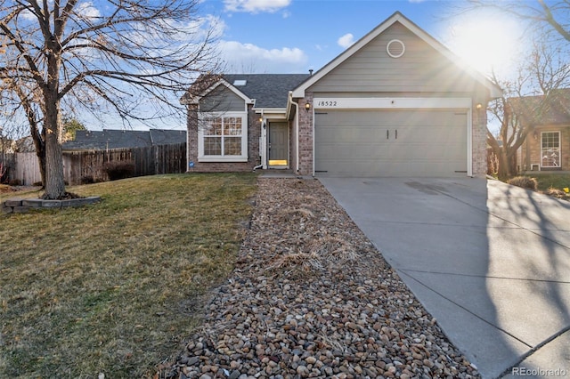 ranch-style house with a front yard and a garage