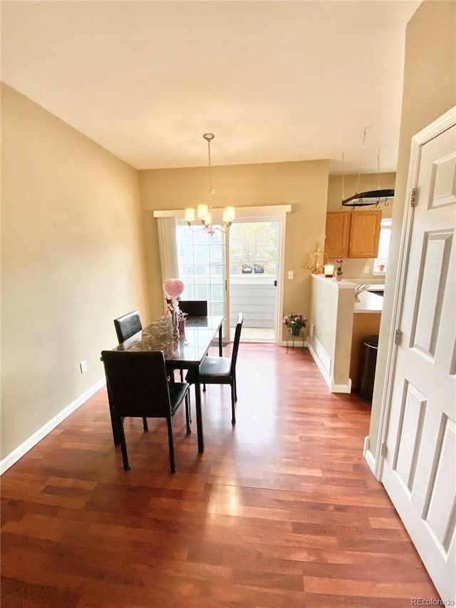 19246 E Idaho Pl Unit 102, Aurora, CO 80017 - dining space with a chandelier and wood finished floors