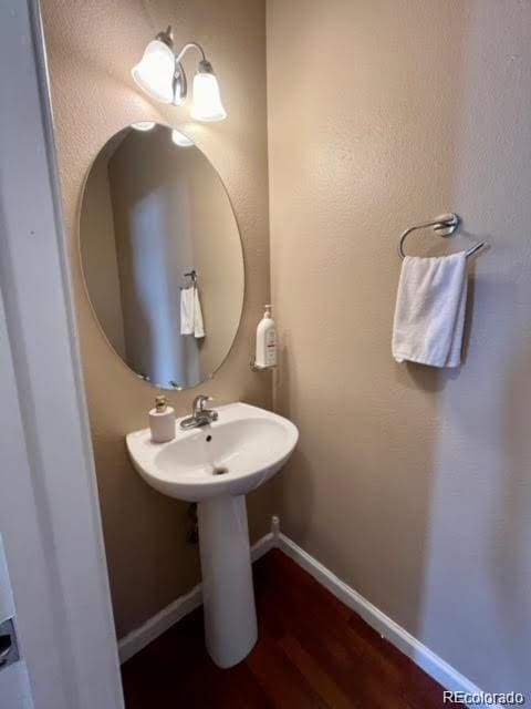 19246 E Idaho Pl Unit 102, Aurora, CO 80017 - bathroom featuring wood finished floors and baseboards