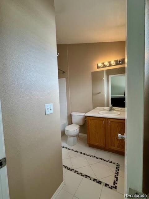 19246 E Idaho Pl Unit 102, Aurora, CO 80017 - bathroom featuring tile patterned floors and vanity