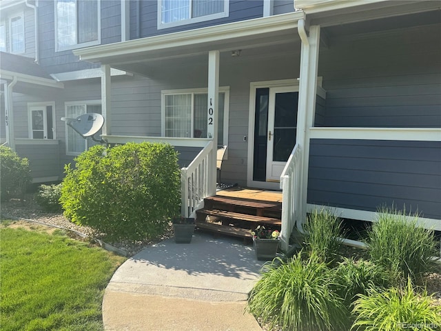 19246 E Idaho Pl Unit 102, Aurora, CO 80017 - view of exterior entry featuring a porch