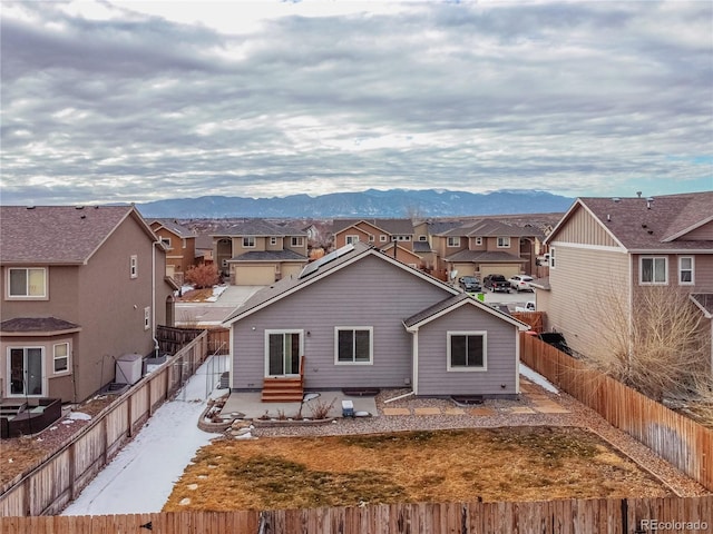 rear view of property featuring a mountain view