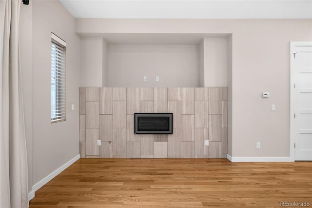 unfurnished living room featuring light wood-type flooring