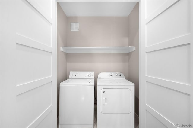 laundry room with independent washer and dryer