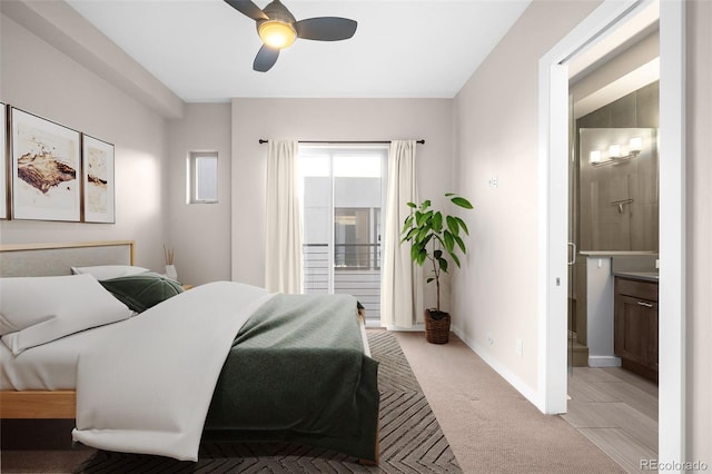 carpeted bedroom featuring connected bathroom and ceiling fan