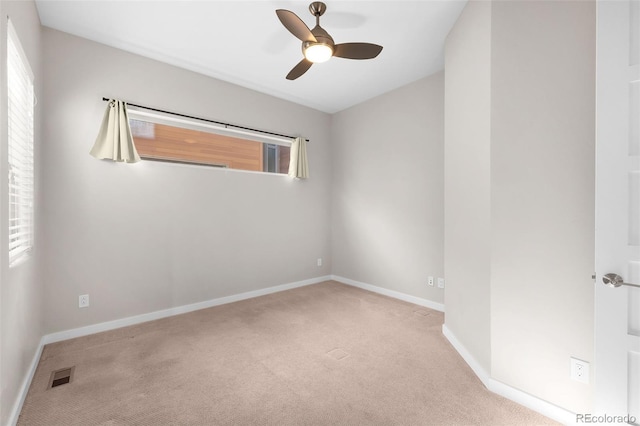 carpeted empty room with ceiling fan