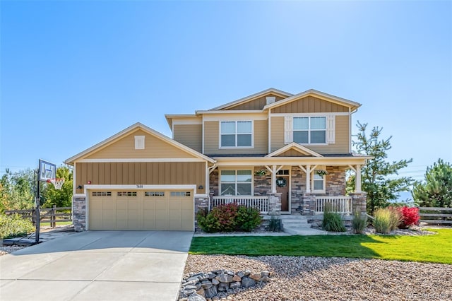 craftsman-style home featuring a porch and a garage