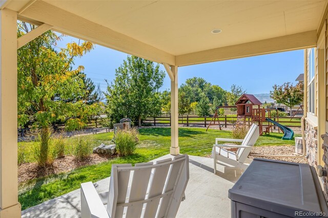 view of patio featuring a playground