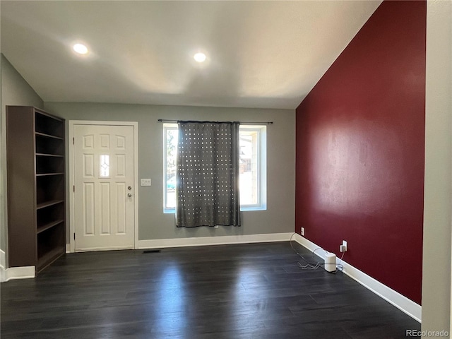 15962 E Exposition Dr, Aurora, CO 80017 - foyer with dark wood finished floors, vaulted ceiling, and recessed lighting
