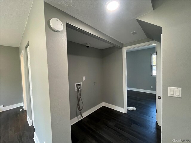 15962 E Exposition Dr, Aurora, CO 80017 - laundry area featuring hookup for a washing machine, wood finished floors, and a textured ceiling