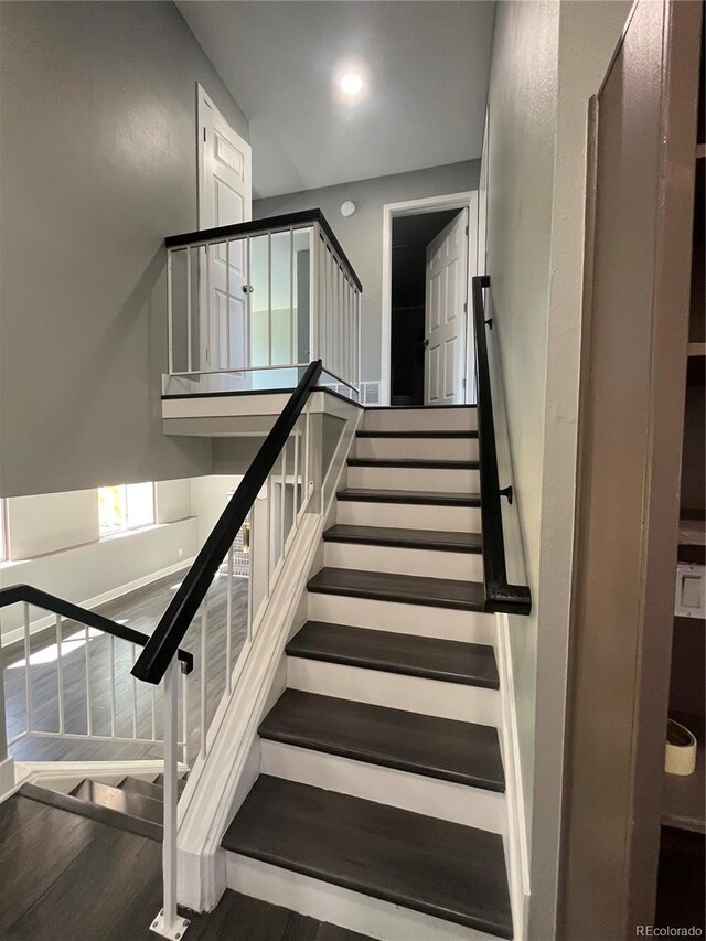 15962 E Exposition Dr, Aurora, CO 80017 - staircase featuring wood finished floors and recessed lighting
