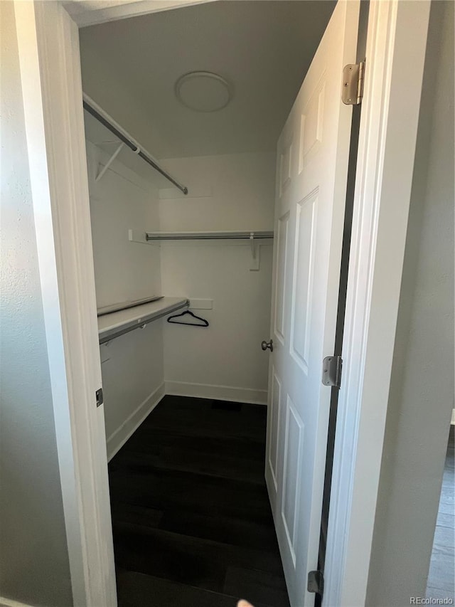 15962 E Exposition Dr, Aurora, CO 80017 - spacious closet featuring dark wood-style flooring
