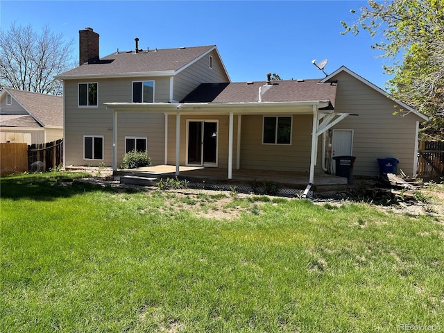 15962 E Exposition Dr, Aurora, CO 80017 - back of house featuring a chimney