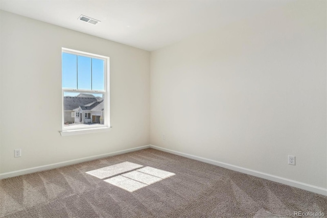 unfurnished room featuring carpet