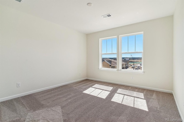 unfurnished room with carpet flooring