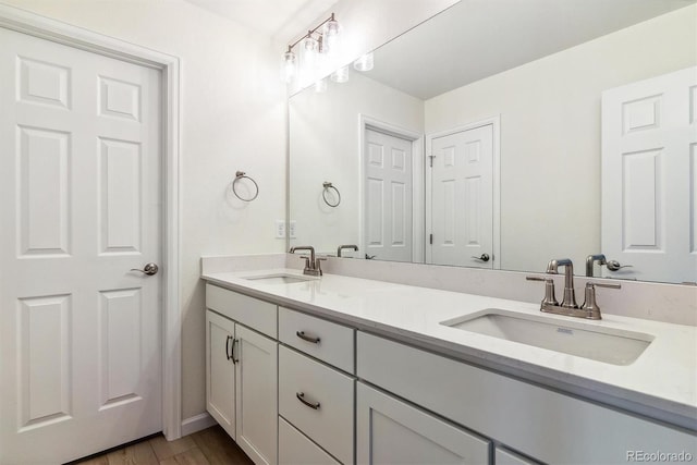 bathroom featuring vanity and hardwood / wood-style flooring