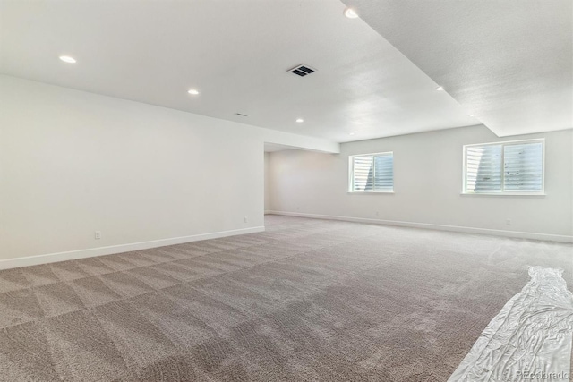 unfurnished room with light carpet