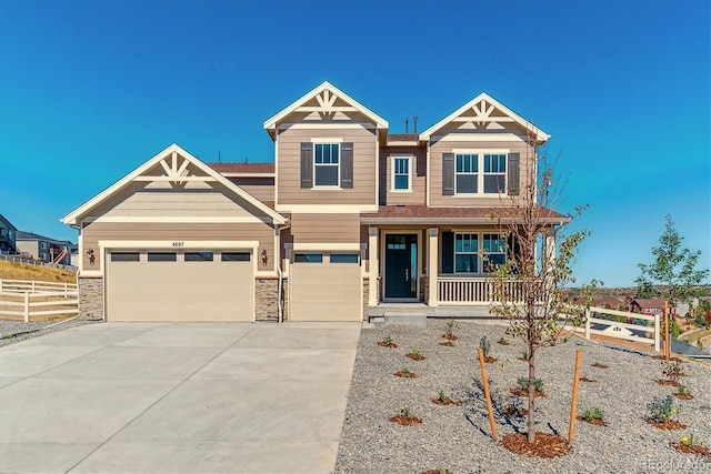 view of front of home with a porch and a garage