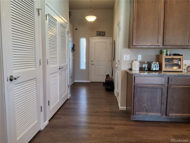 interior space with dark wood-type flooring