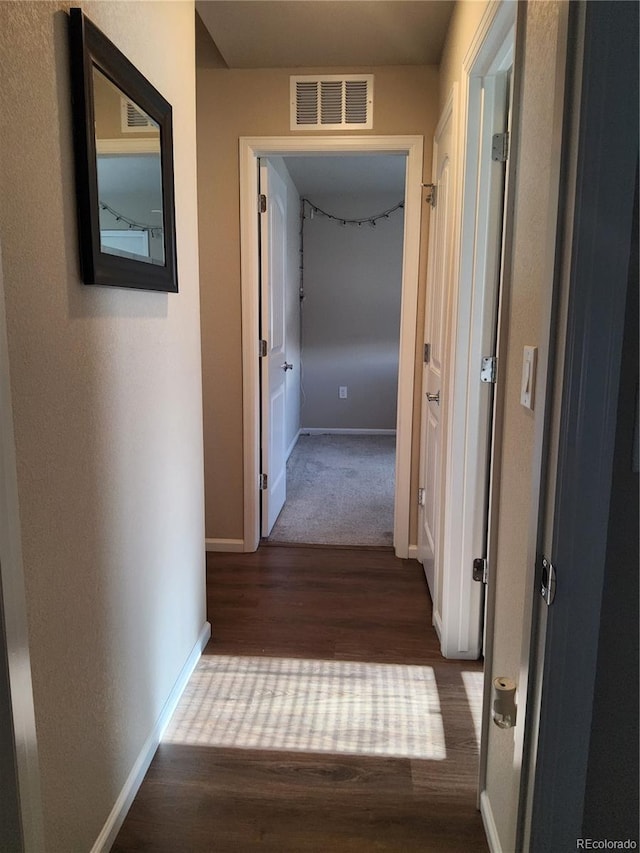 corridor featuring wood-type flooring