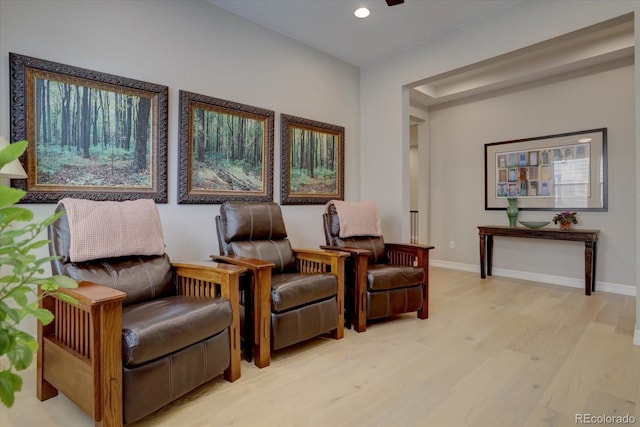 living area with light hardwood / wood-style flooring