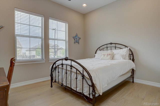 bedroom with light hardwood / wood-style flooring