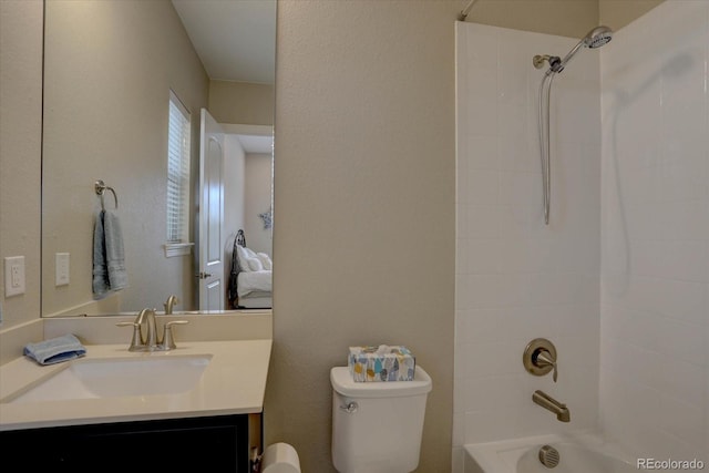 full bathroom featuring vanity, toilet, and tiled shower / bath combo