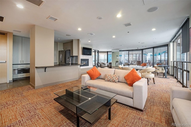 1625 Larimer St Unit 605, Denver, CO 80202 - living room featuring recessed lighting and light colored carpet