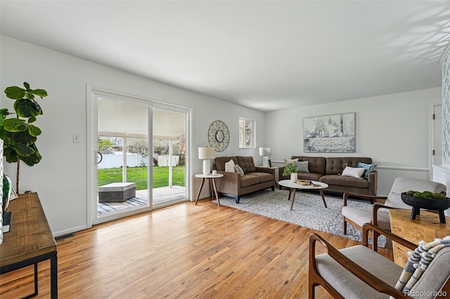 7751 S Race St, Centennial, CO 80122 - living area featuring plenty of natural light and light wood-style flooring